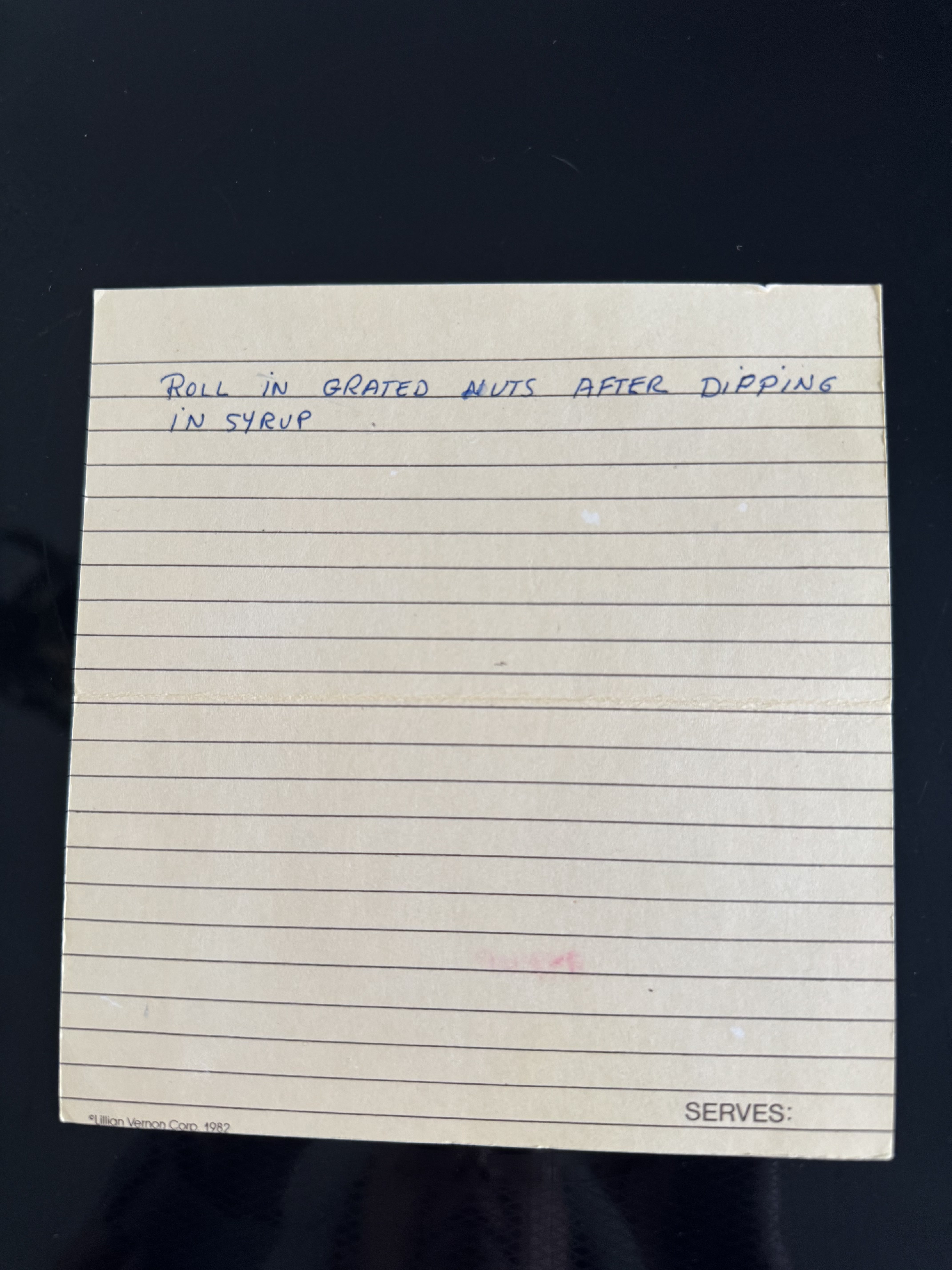 Roll in grated nuts after dipping in syrup